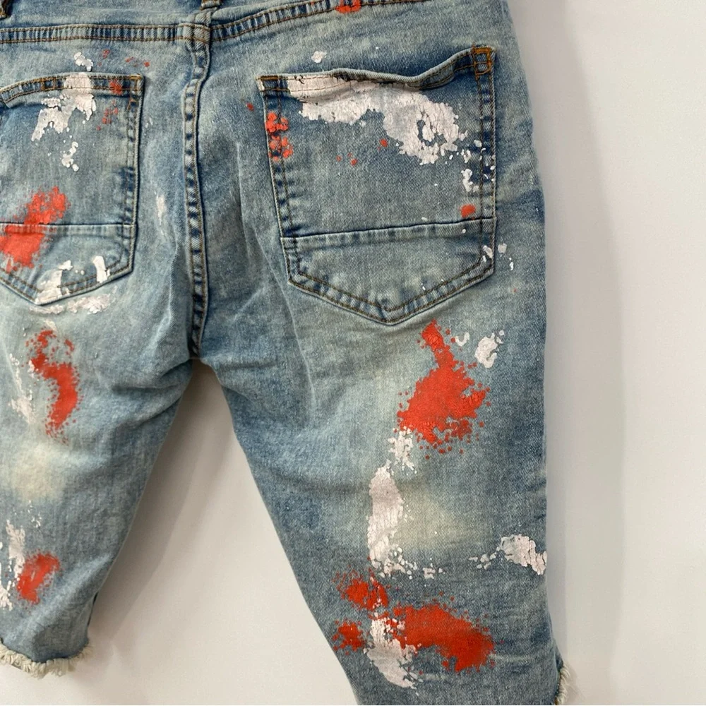 Distressed Paint-Splatter Men’s Denim Shorts in Blue with Red Accents